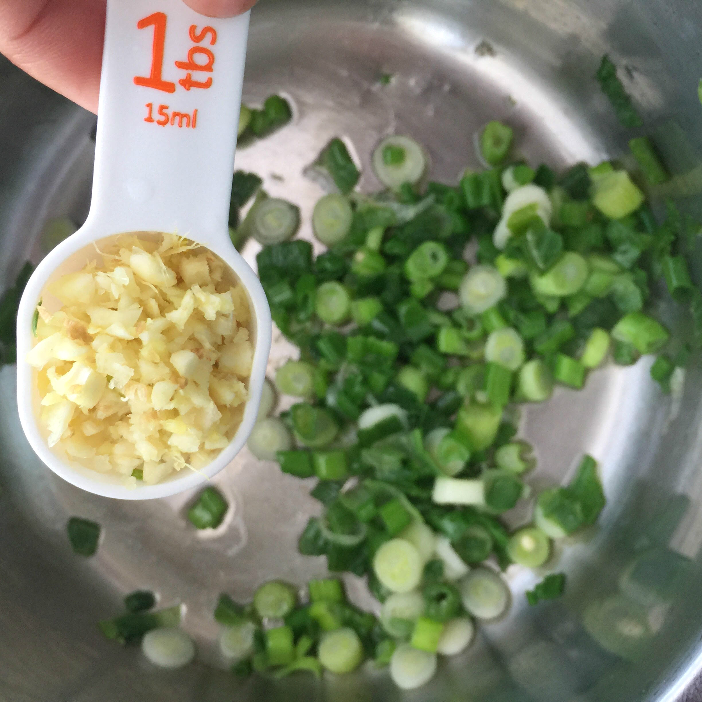 Chopped ginger+garlic add into sauted green onions