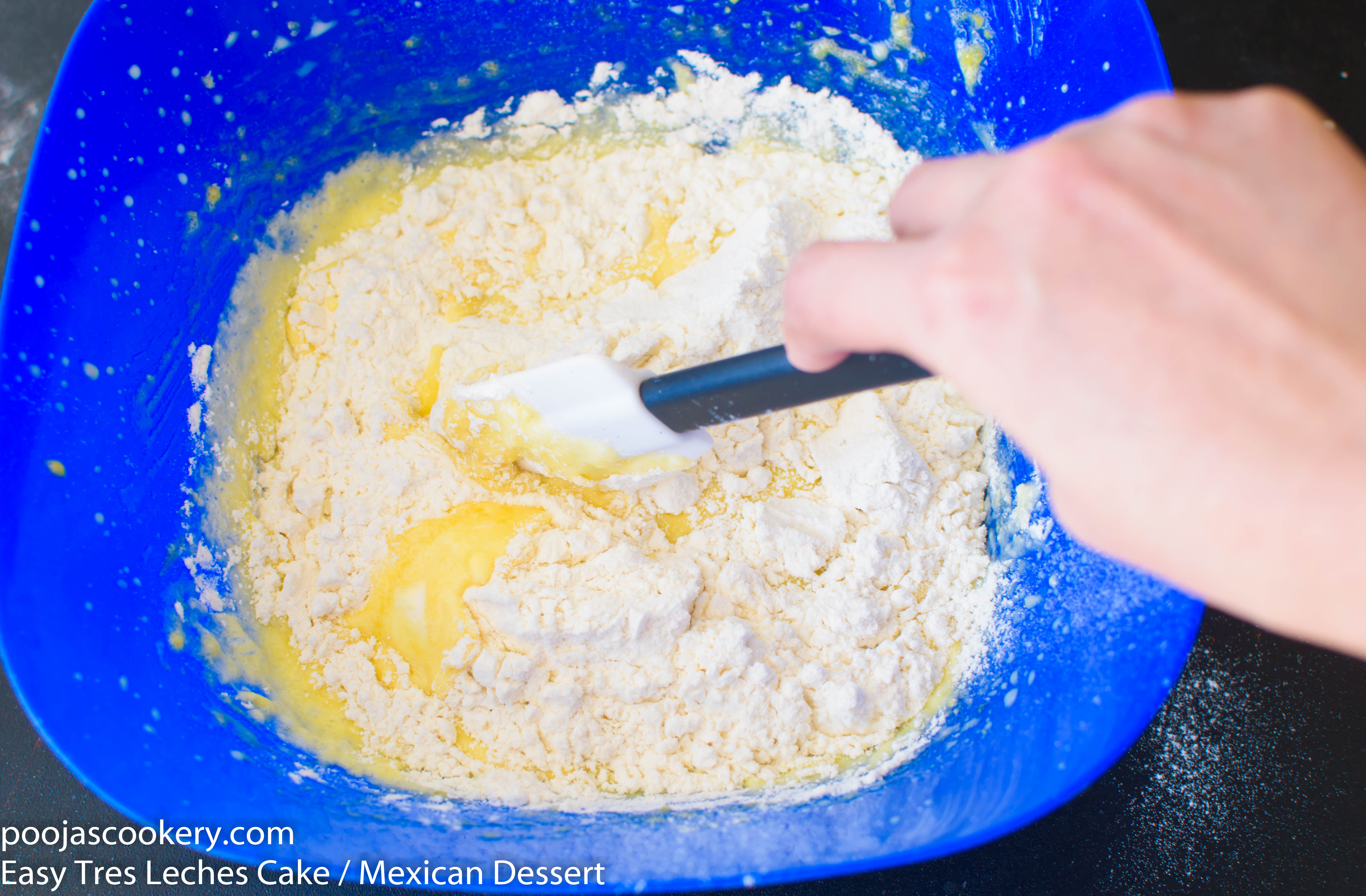 Sifted flour and baking powder into into beaten egg yolks